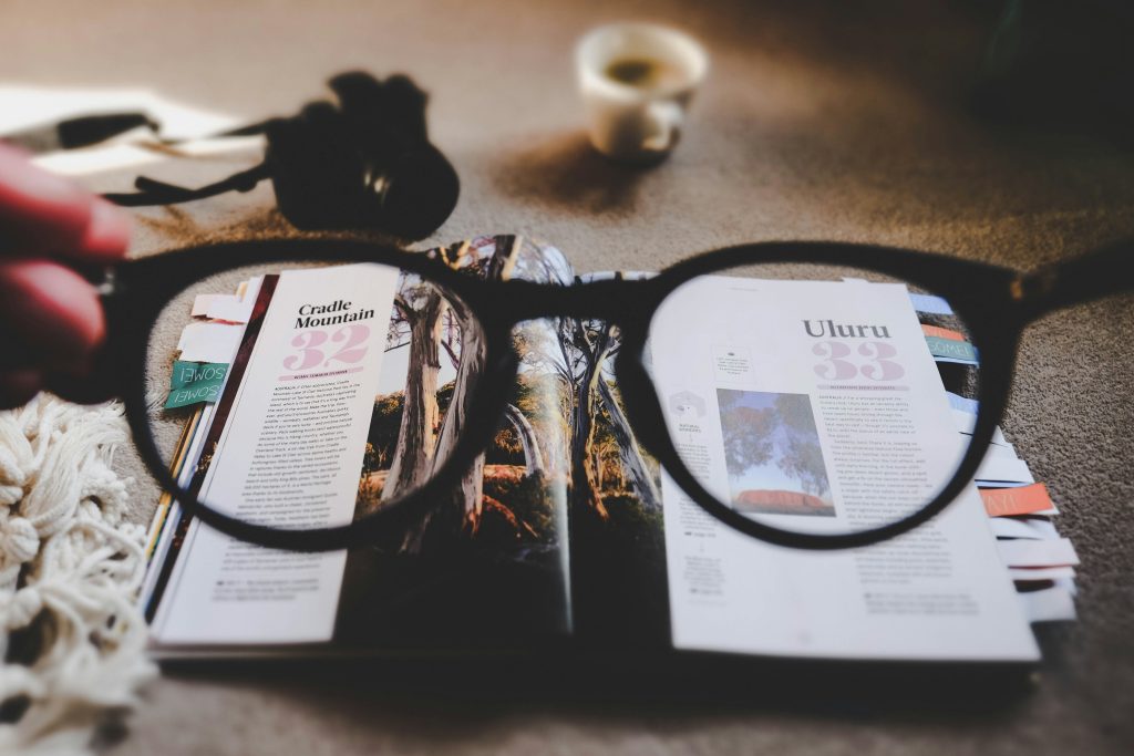 a glasses on the magazine